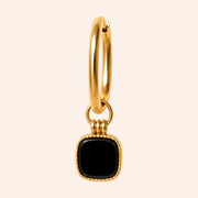 Caméléa Nox interchangeable earring charm featuring a square black onyx stone with a gold-toned stainless steel rim