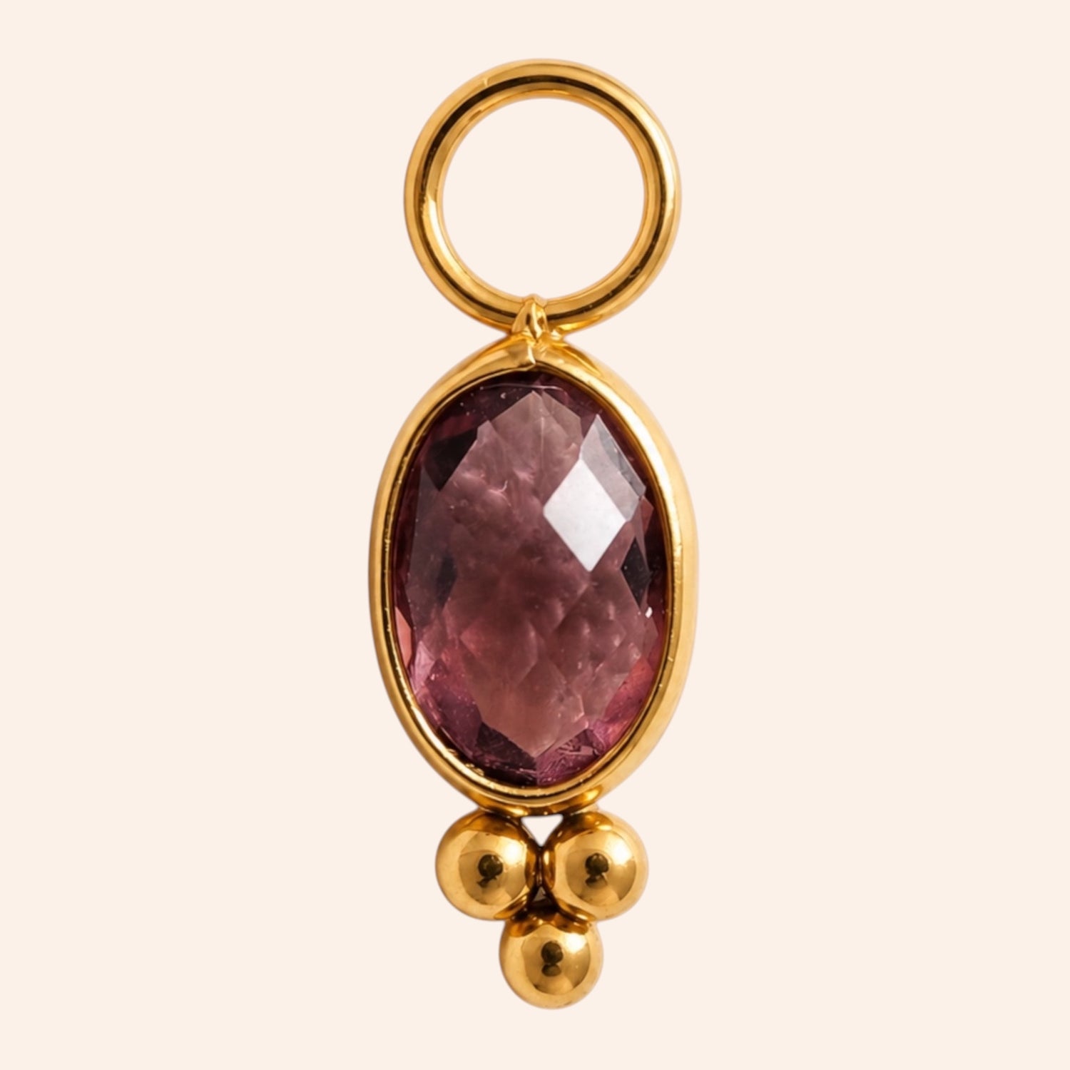 Ma boutique Ambre interchangeable earring charm featuring an oval amber-toned stone set in gold-tone stainless steel.