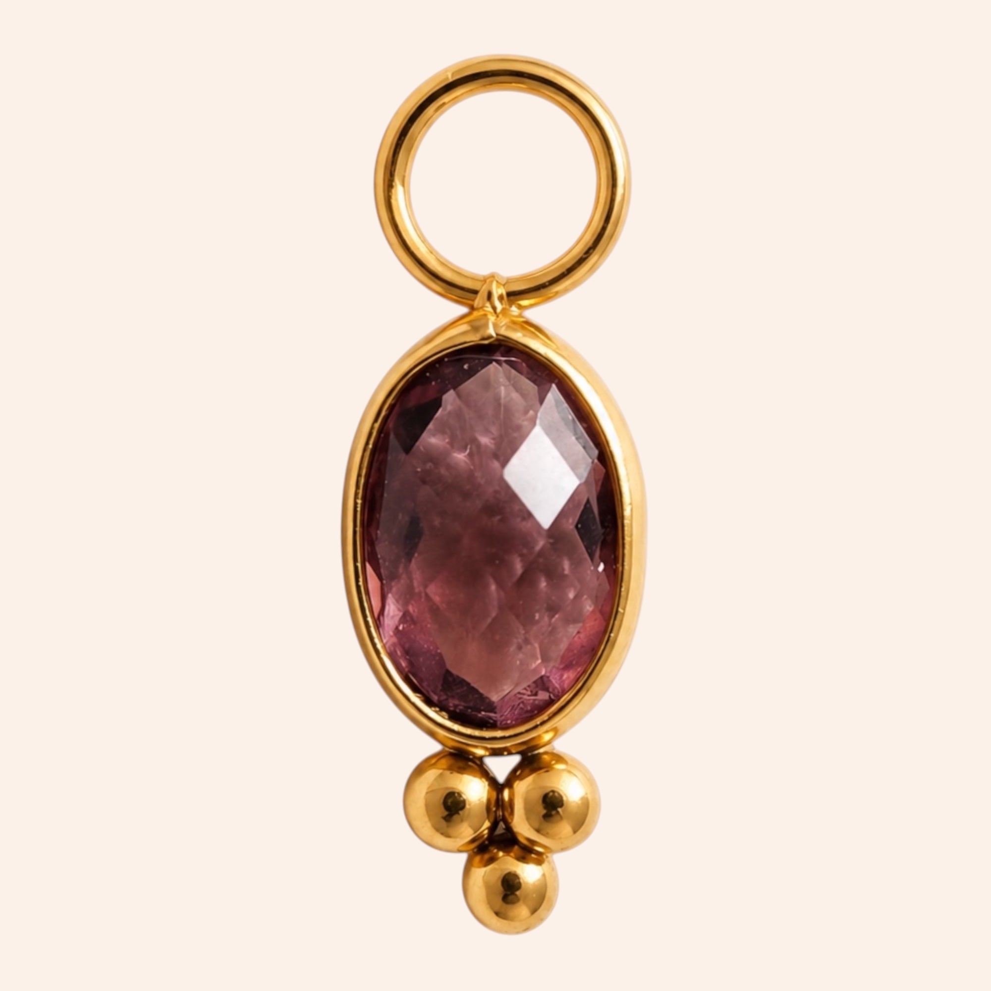 Ma boutique Ambre interchangeable earring charm featuring an oval amber-toned stone set in gold-tone stainless steel.