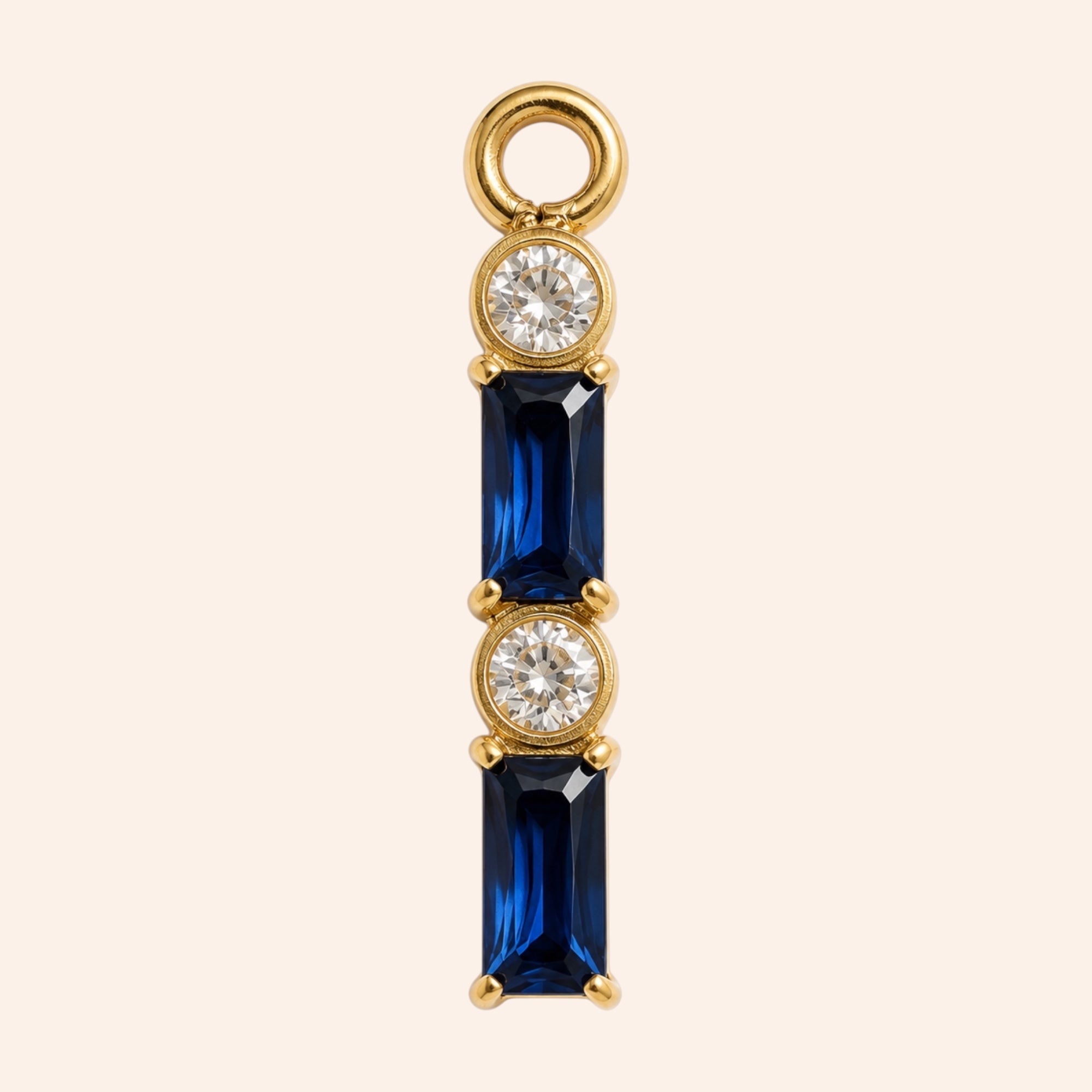 Ma boutique interchangeable earring charm featuring blue baguette stones and clear round crystals in gold-tone steel