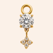 Ma boutique Céleste gold interchangeable earring charm with a round clear stone and a small star-shaped crystal detail