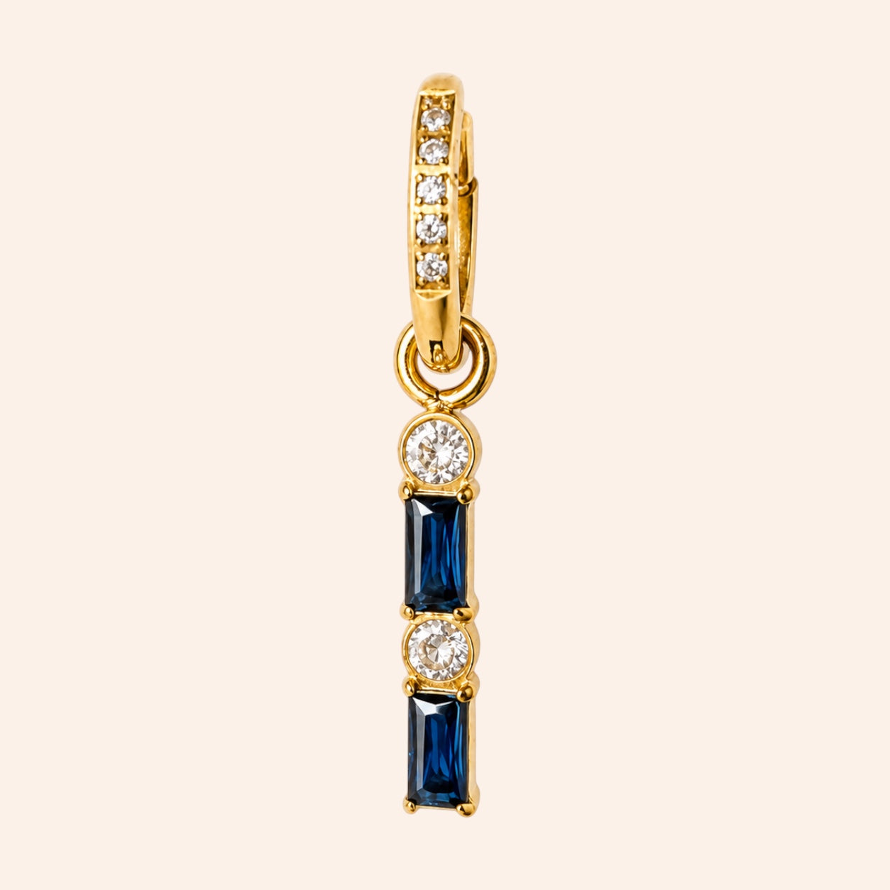 Ma boutique Emeraude interchangeable earring charm with gold-tone stainless steel, blue baguette stones, and crystals.