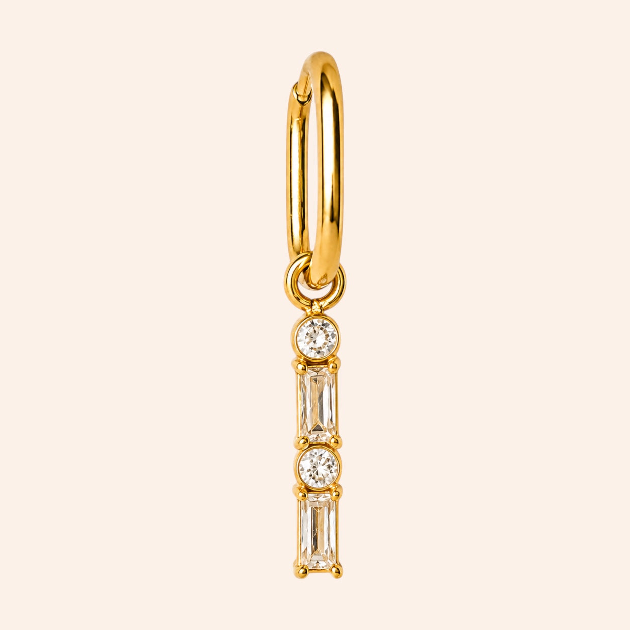 Ma boutique Emeraude interchangeable earring charm featuring clear baguette and round stones in a gold stainless setting