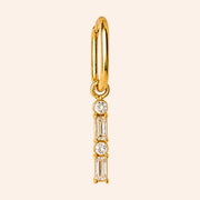 Ma boutique Emeraude interchangeable earring charm featuring clear baguette and round stones in a gold stainless setting