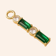 Ma boutique Emeraude interchangeable earring charm featuring elongated green stones and clear crystals in gold plating.