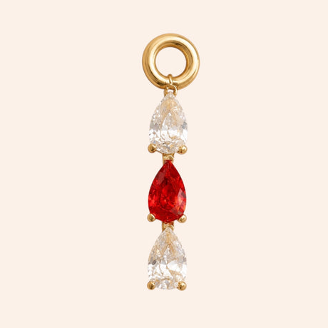 Ma boutique Goutte interchangeable earring charm with gold setting and three teardrop-shaped red and clear stones