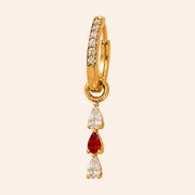 Ma boutique Goutte interchangeable gold earring charm with teardrop-shaped clear and red stones on a hoop base