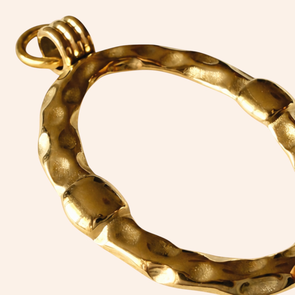 Ma boutique Halo interchangeable gold stainless steel earring charm with a textured oval design