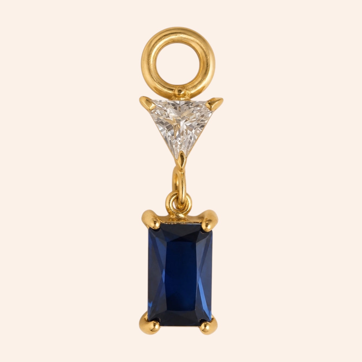 Ma boutique Minuit interchangeable earring charm with a rectangular midnight blue stone and gold setting.