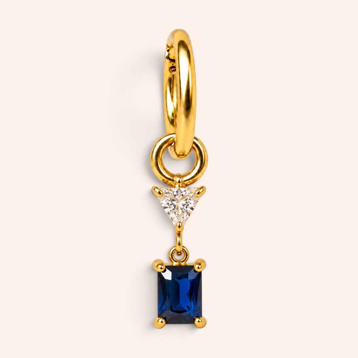 Ma boutique Minuit interchangeable earring charm featuring a rectangular deep blue stone on a gold stainless steel base
