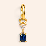 Ma boutique Minuit interchangeable earring charm featuring a rectangular deep blue stone on a gold stainless steel base
