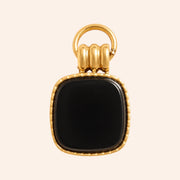 Ma boutique Nox interchangeable earring charm featuring a square black onyx stone set in gold-tone stainless steel.