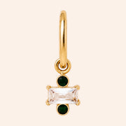 Ma boutique Regard interchangeable gold earring charm with a rectangular clear stone and two small green accents