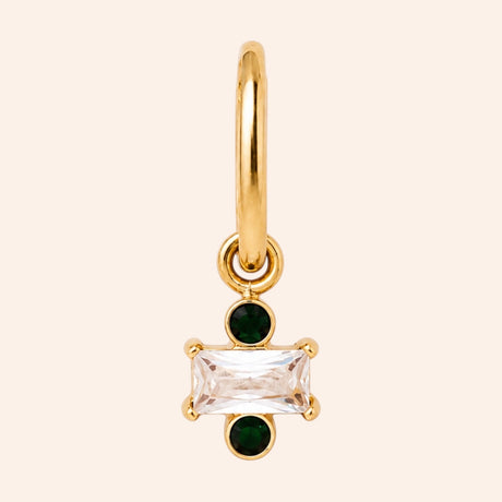 Ma boutique Regard interchangeable gold earring charm with a rectangular clear stone and two small green accents