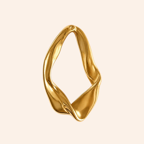 Ma boutique Sillage gold-plated stainless steel interchangeable earring charm with an organic sculptural shape.