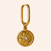 Ma boutique Sol gold sun medallion charm for hoop earrings with a central crystal detail and textured finish.